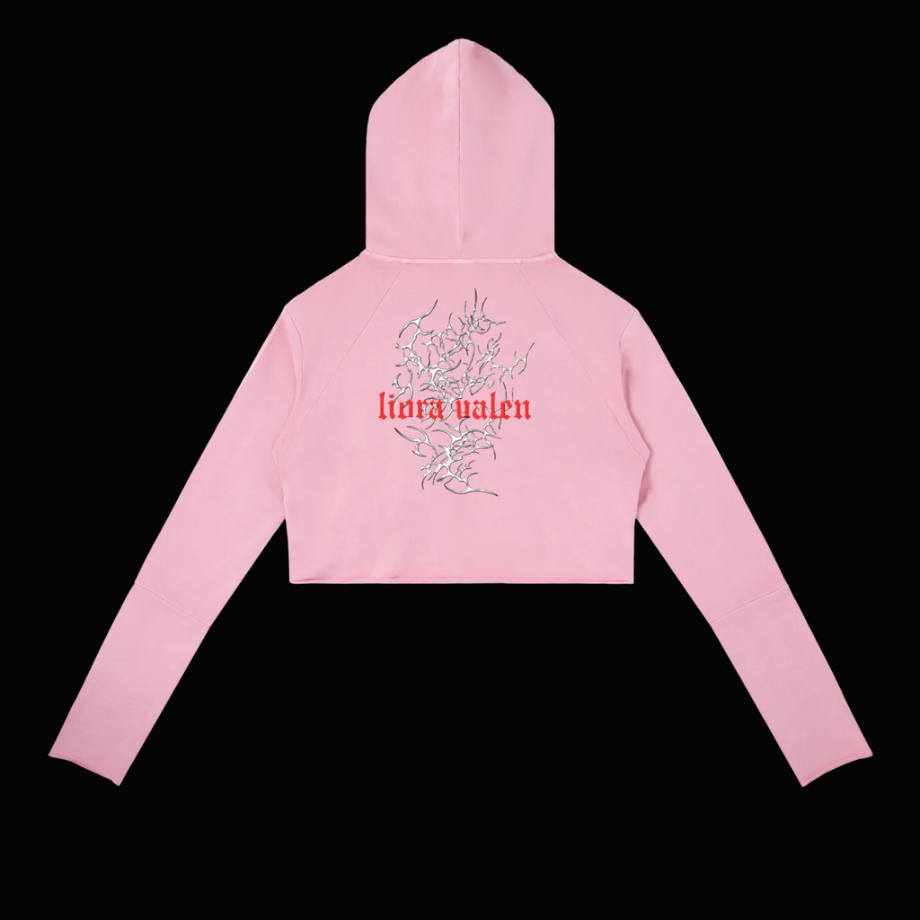 Pink hoodie with floral design and 'lura valen' text on a white background