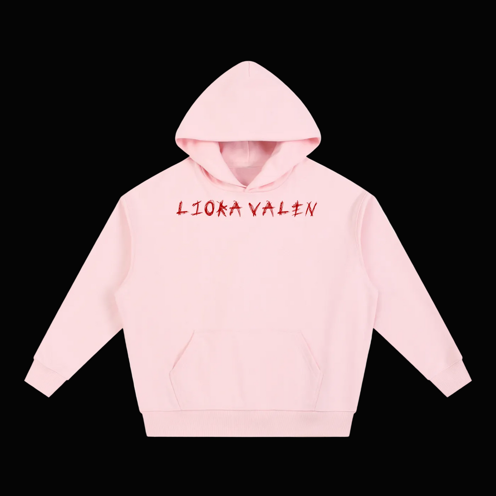 Pink hoodie with 'LIOKA VALEN' text on a white background