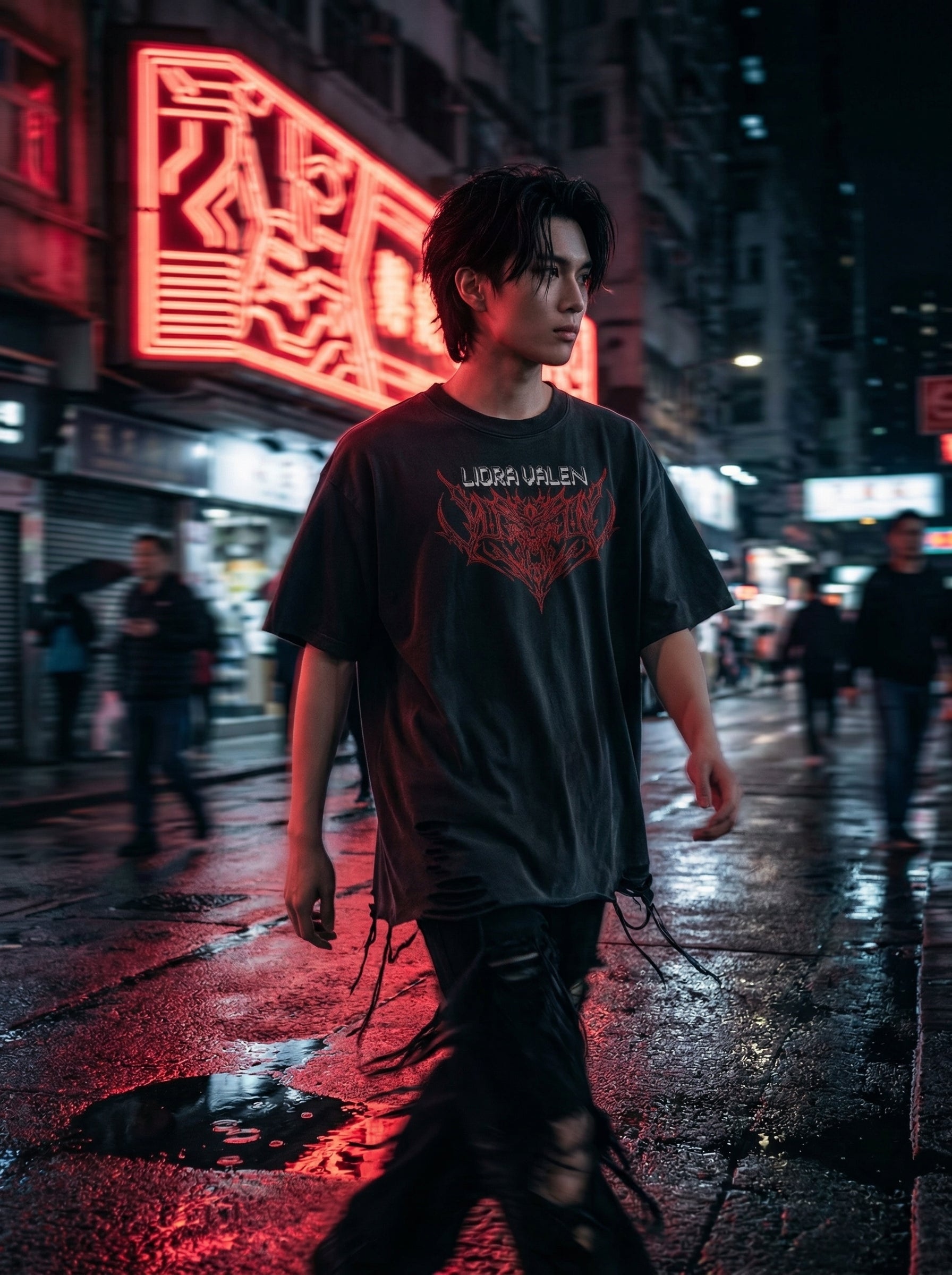 Person wearing a black t-shirt with red text in a neon-lit urban street at night.